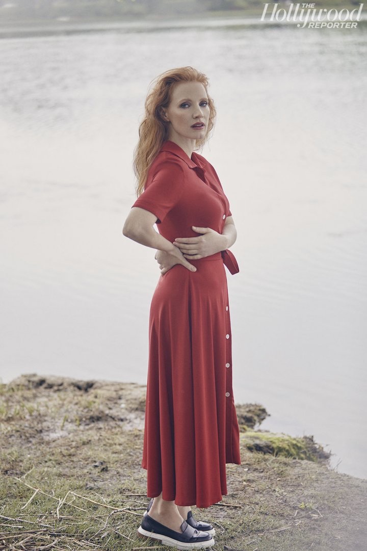 Posing in a red dress, Jessica Chastain is a striking vision