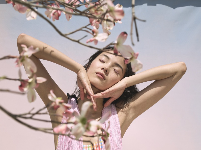 Xiao Wen Ju poses with cherry blossoms for La Ligne's summer 2018 campaign