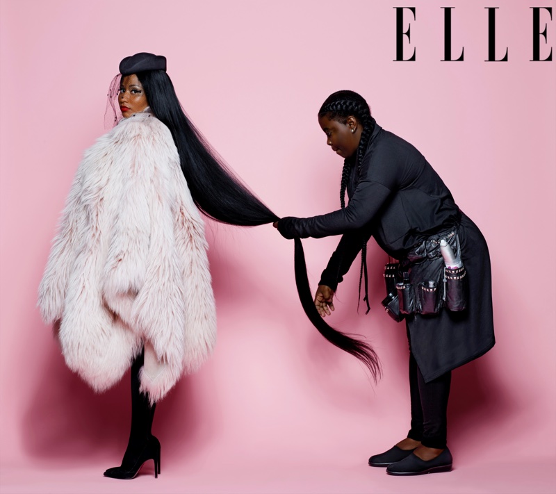 Rapper Nicki Minaj poses in Nini Ricci fur coat and veil hat with Stuart Weitzman pumps