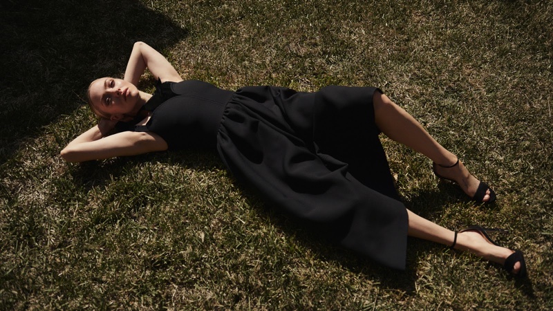 Laying on the grass, Amanda Seyfried wears Fendi dress and Jimmy Choo sandals