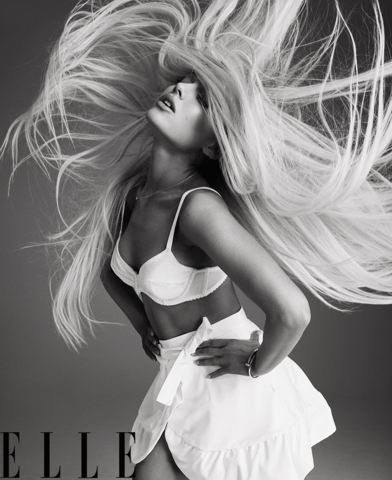 Whipping her hair, Ariana Grande wears Fleur du Mal bra and skirt