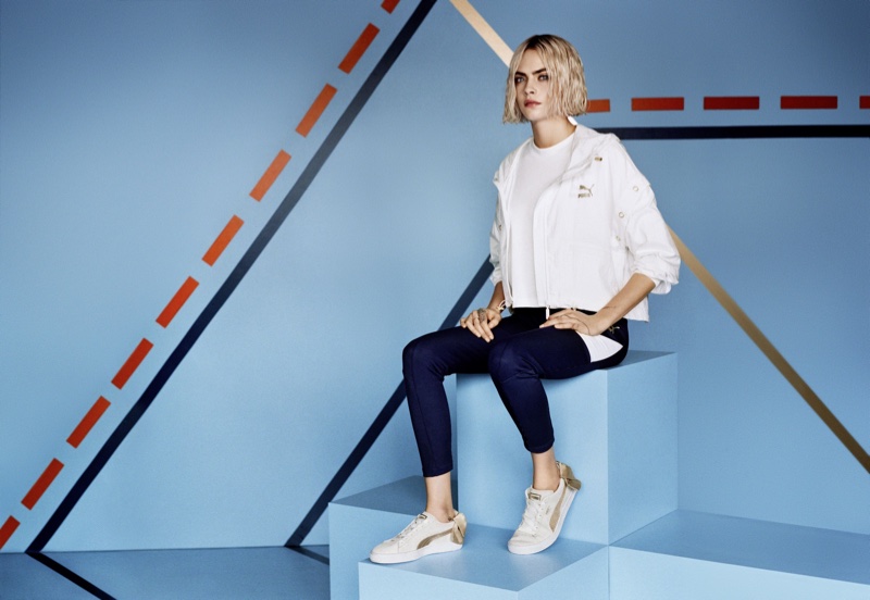 Cara Delevinge poses in new PUMA campaign wearing the Suede Bow Varsity sneaker