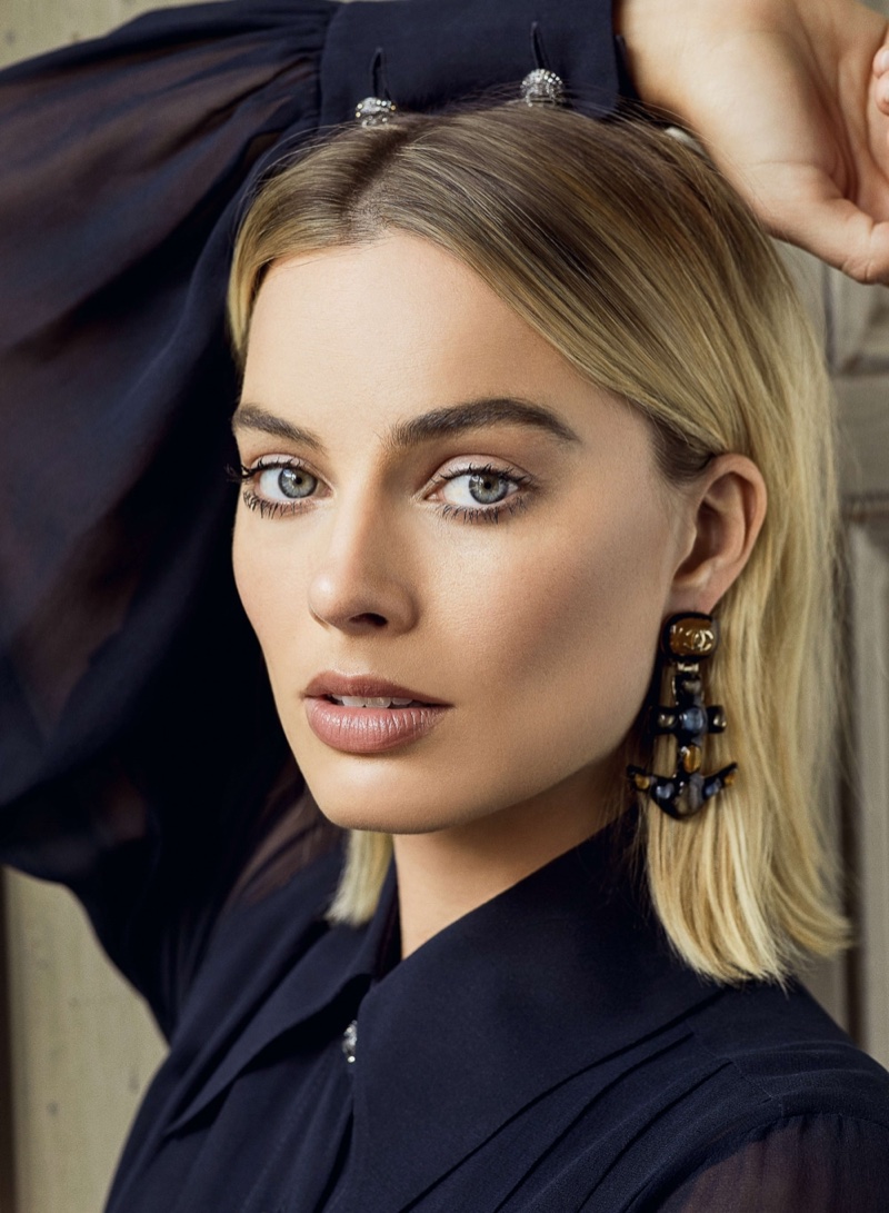 Ready for her closeup, Margot Robbie wears Chanel blouse and earrings