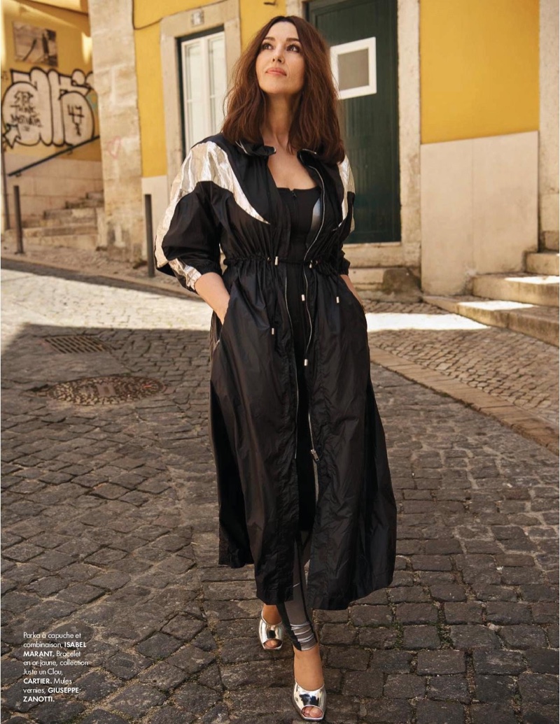 Monica Bellucci poses in Isabel Marant parka and jumpsuit with Giuseppe Zanotti mules