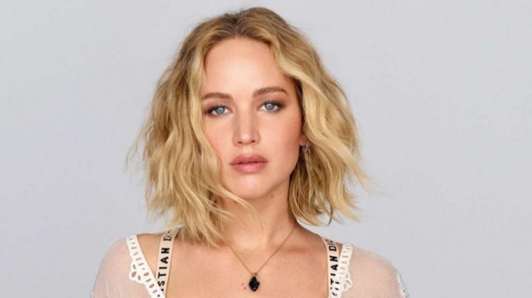 Actress Jennifer Lawrence poses in Dior dress and undergarments