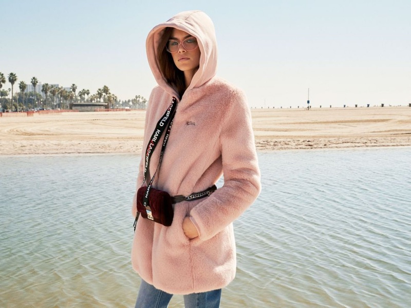 Kaia Gerber wears pink hooded jacket from the Karl Lagerfeld x Kaia Gerber capsule collection