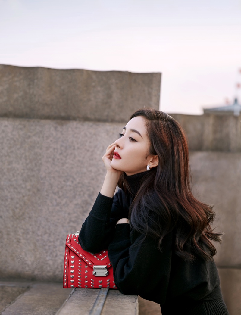 Yang Mi poses with Yang Mi x Michael Kors Whitney handbag