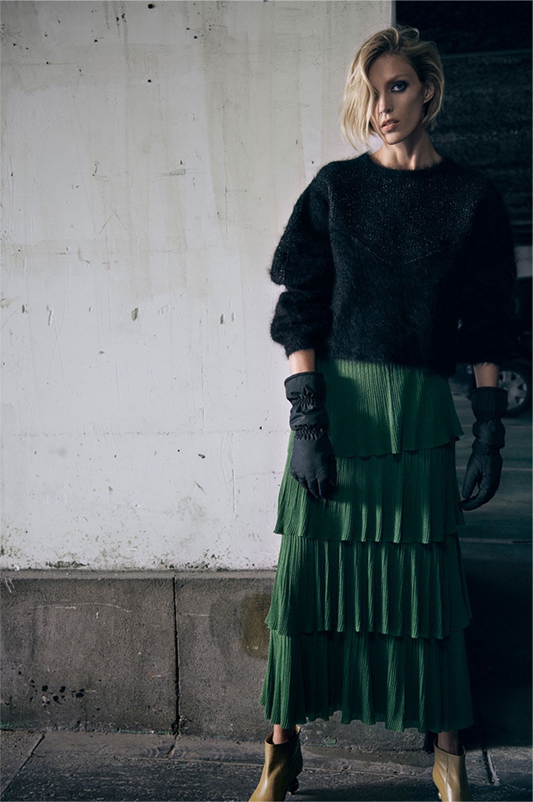 Zara Black Sweater, Green Pleated Skirt and Nylon Gloves