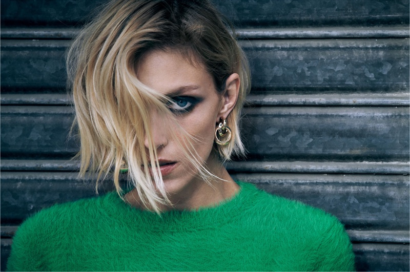 Anja Rubik models green Zara sweater and gold hoop earrings
