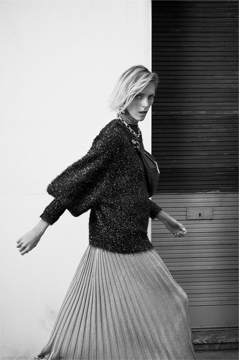 Zara features metallic sweater and pleated skirt