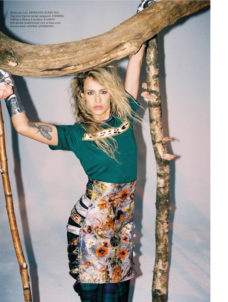 Alice Dellal poses in Ermmano Scervino leather gloves, Iceberg top, Kaimin apron and Astrid Anderson kilt