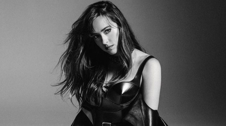 Photographed in black and white, Dakota Johnson wears ruffled dress