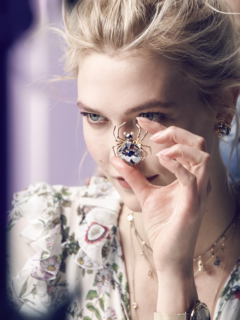 Karlie Kloss shows off a spider pendant on set of Swarovski winter 2018 shoot