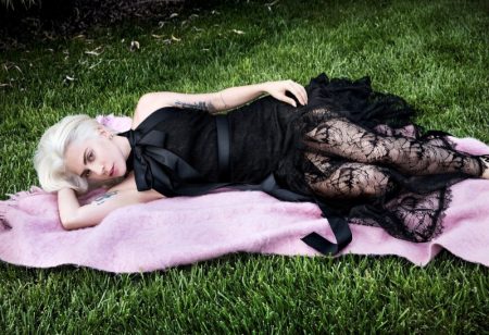 Lady Gaga Covers Vogue, Talks 'A Star is Born' Laying in grass, Lady Gaga wears Chanel dress and Delfina Delettrez earring