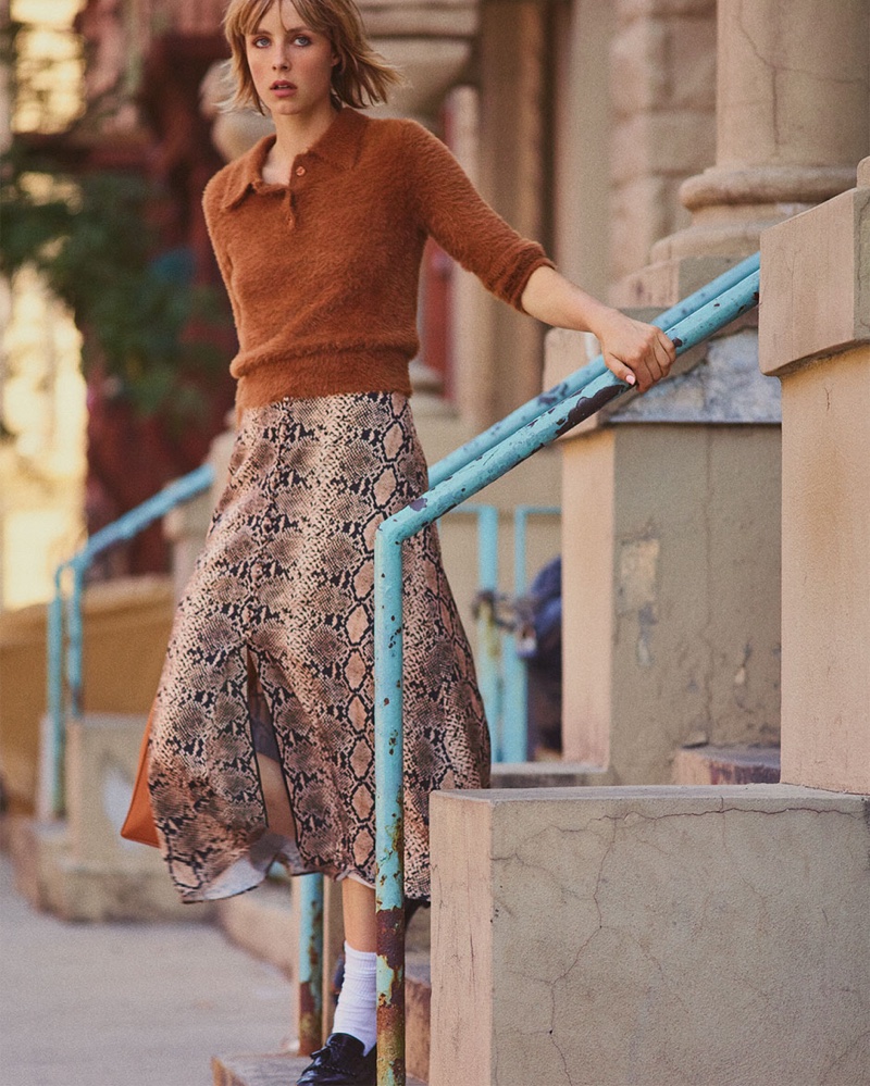 Edie Campbell models Zara Textured Polo Sweater, Snake Print Skirt and Leather Loafers