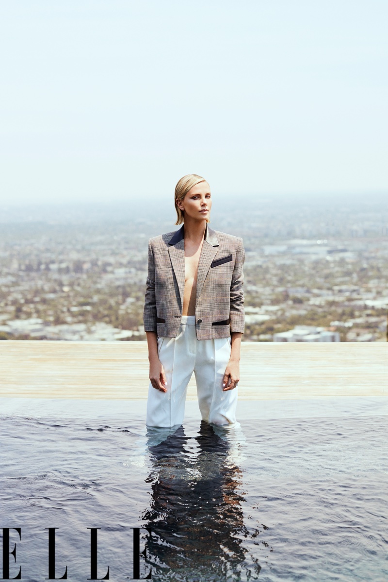 Charlize Theron wears Louis Vuitton jacket and pants