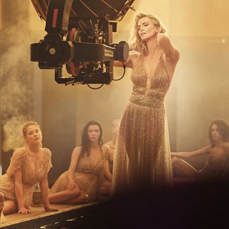 BEHIND THE SCENES: Charlize Theron shines in gold dress for Dior J'adore Absolu fragrance shoot