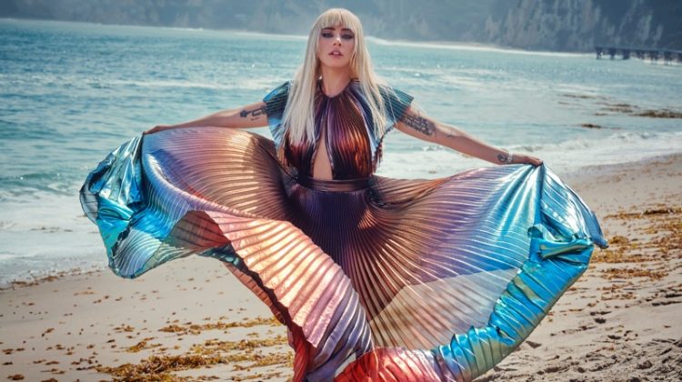 Posing on the beach, Lady Gaga wears pleated and multicolored dress
