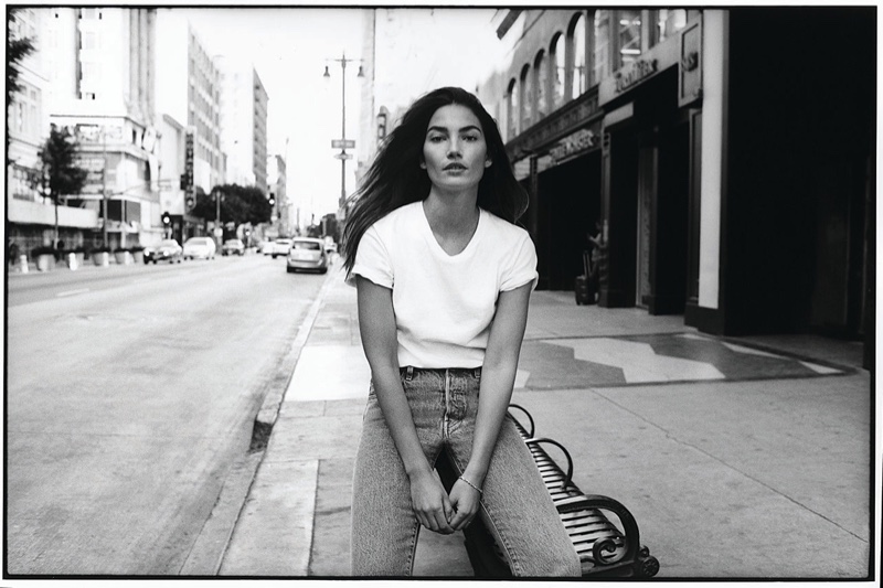 Model Lily Aldridge poses in a white tee and jeans from Levi's