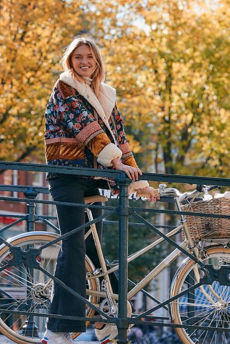 Romee Strijd Has a 'Seasonal Escape' in Free People's New Arrivals Free People Out With A Bang Coat, Maddox Denim Flare Jeans and New Balance 840 Trainer