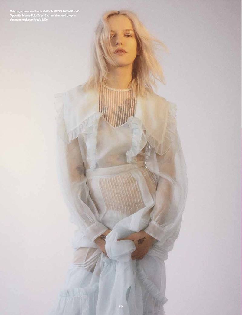 Dressed in white, Bria Vinaite poses in Calvin Klein dress