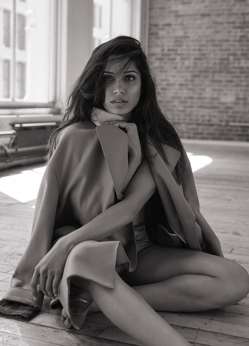 Actress Freida Pinto poses in a black and white image