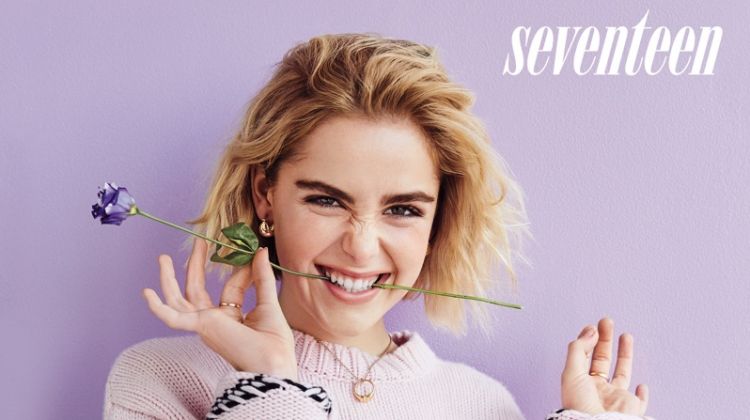 Kiernan Shipka poses in Alanui sweater, Maggie Marilyn pants and Ana Luisa earrings