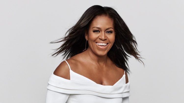 Wearing a Cushnie dress and Jenny Bird earrings, Michelle Obama is all smiles