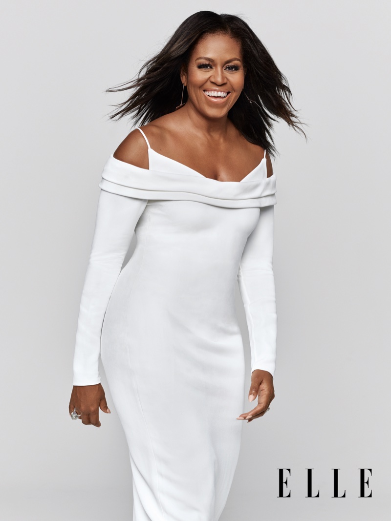 Wearing a Cushnie dress and Jenny Bird earrings, Michelle Obama is all smiles