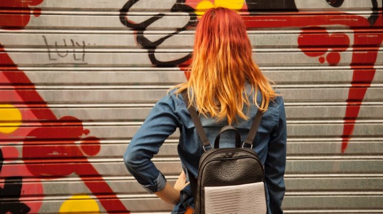 Girl with Red Hair and Backpack