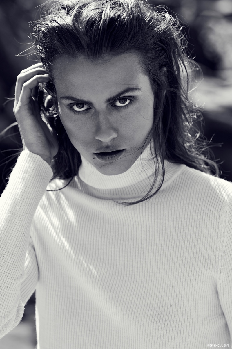 Uniqlo White Turtleneck Sweater. Photo: Milos Mlynarik