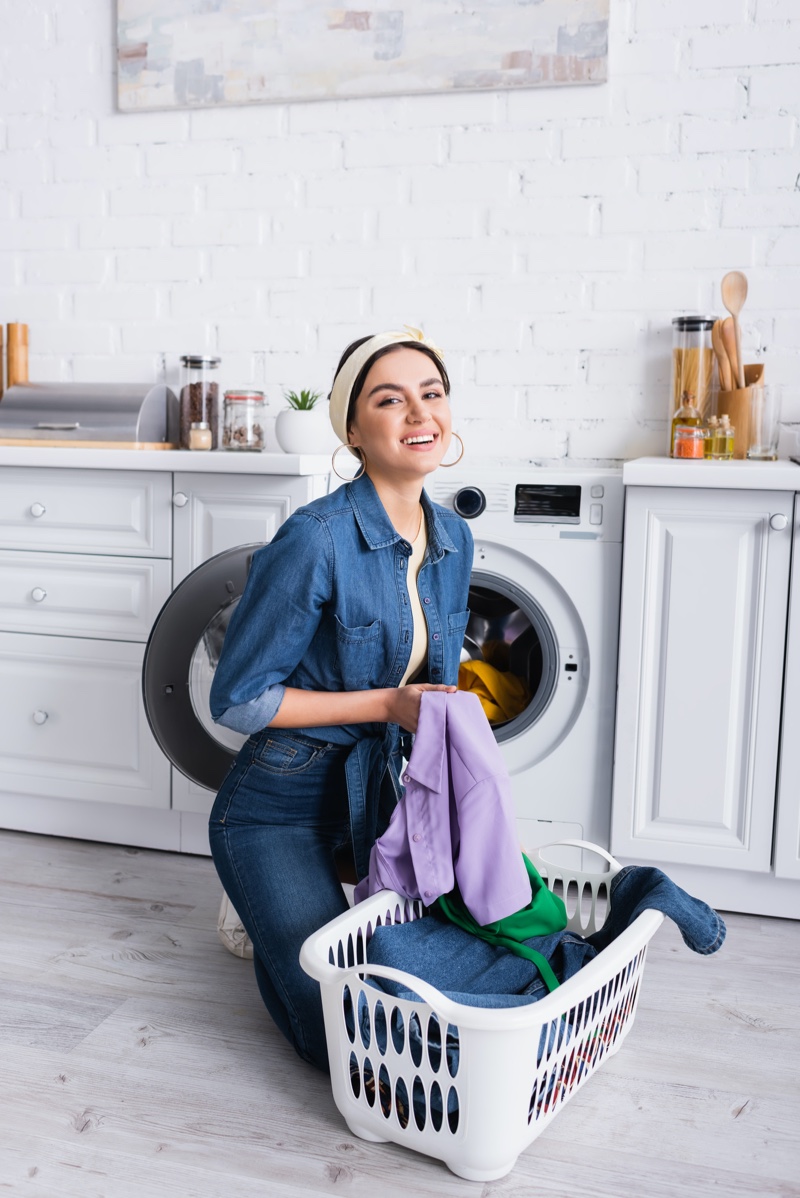 Smiling Woman Doing Laundry