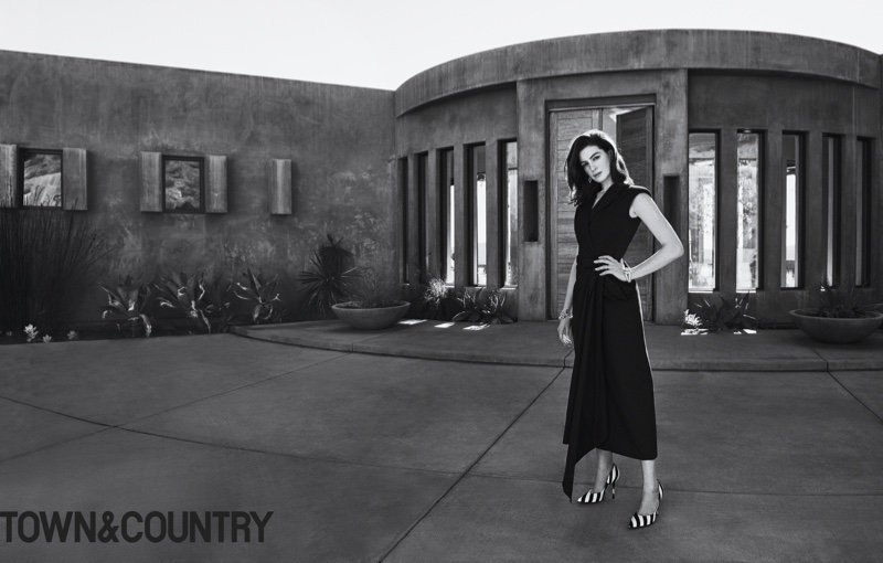 Anne Hathaway poses in Dries Van Noten dress and heels