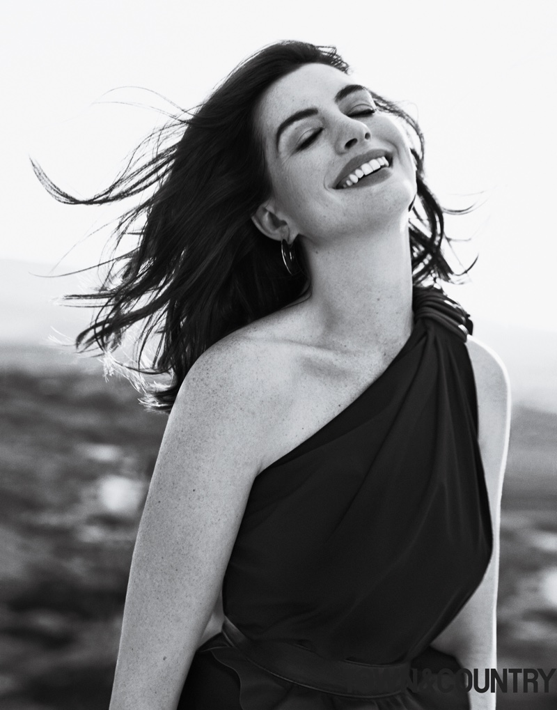 Actress Anne Hathaway wears Max Mara dress and Vhernier earrings