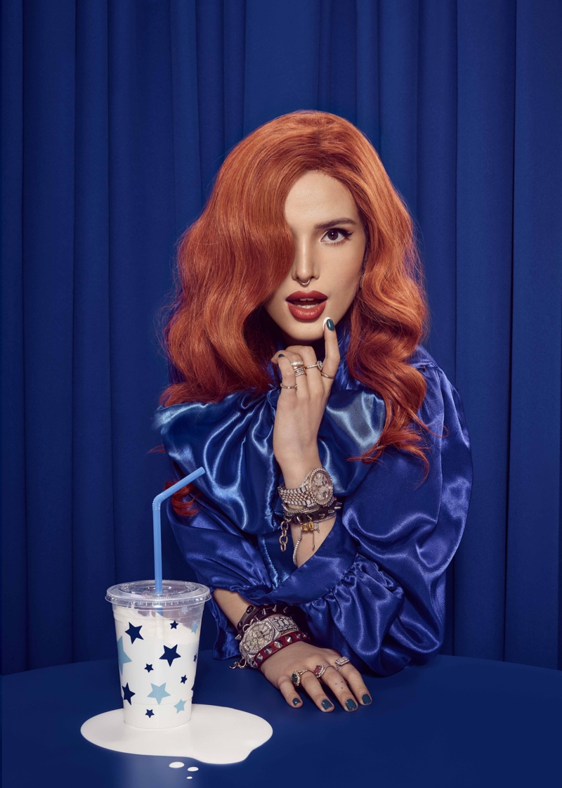 Bella Thorne stands out in a blue top