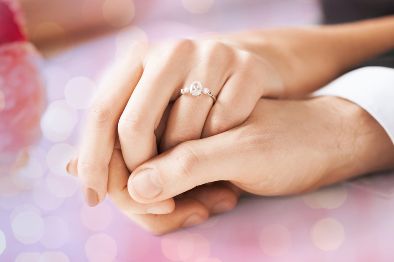 Engagement Ring Couple Wearing Hands