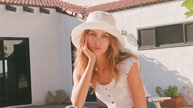 Free People Marilyn Eyelet Bucket Hat $48, Louie Louie Tee $48 and We The Free Daisy Jeans $168