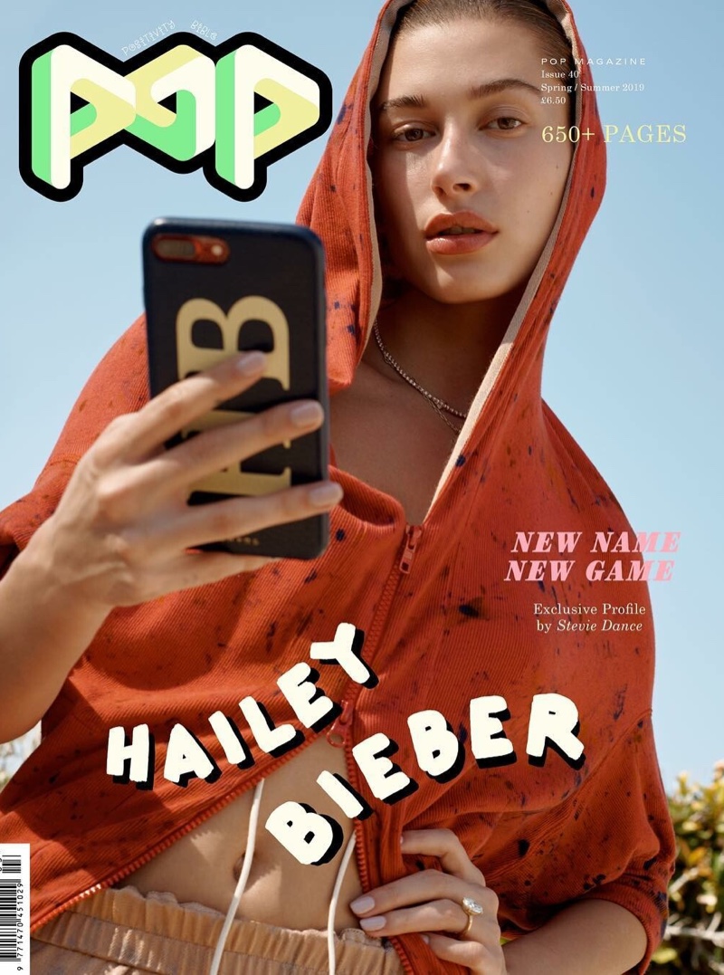 Hailey Baldwin poses with a cellphone on POP Magazine Spring/Summer 2019 Cover