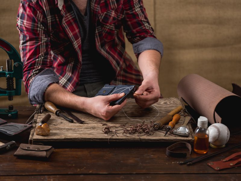 Man Making Leather Wallet