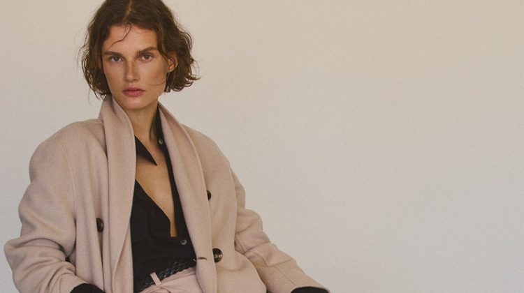 Giedre Dukauskaite wears wool coat and trousers from Massimo Dutti