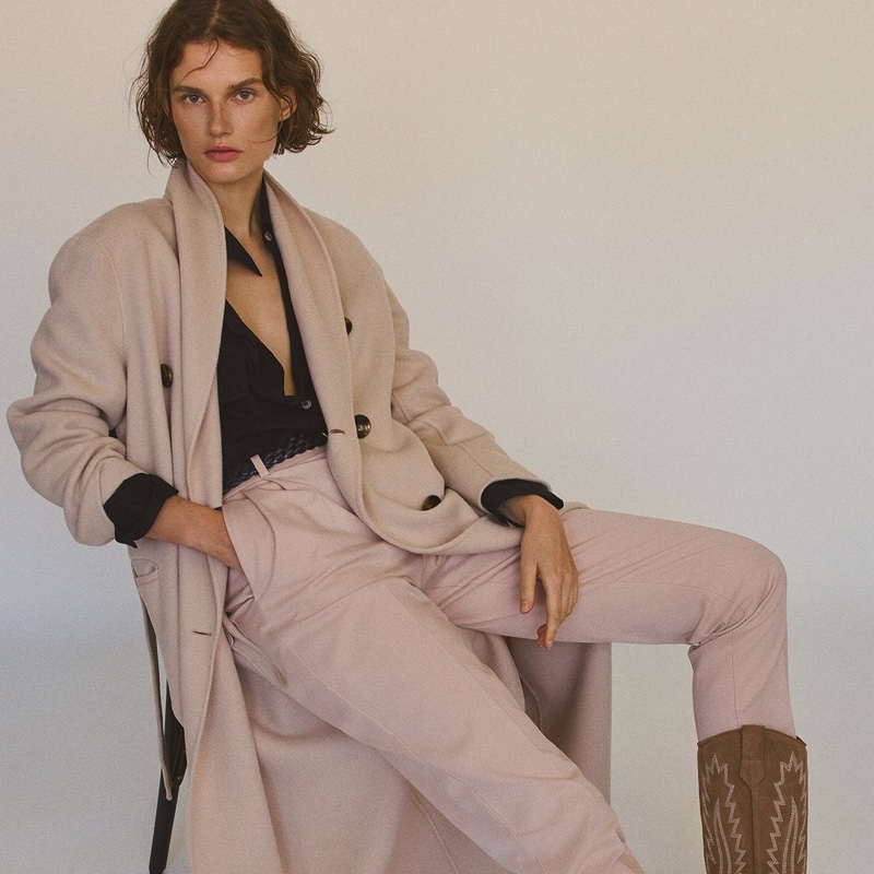 Giedre Dukauskaite wears wool coat and trousers from Massimo Dutti