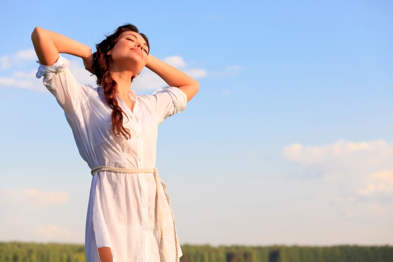 Woman Posing in Field and Happy