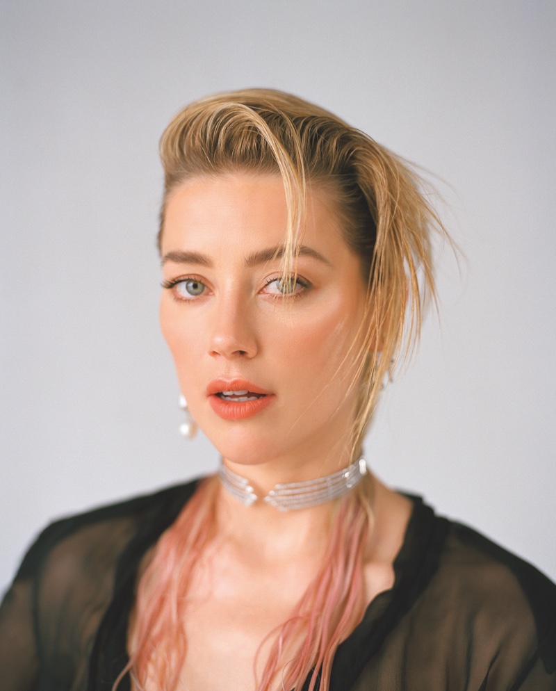 Getting her closeup, Amber Heard poses in sparkling jewelry