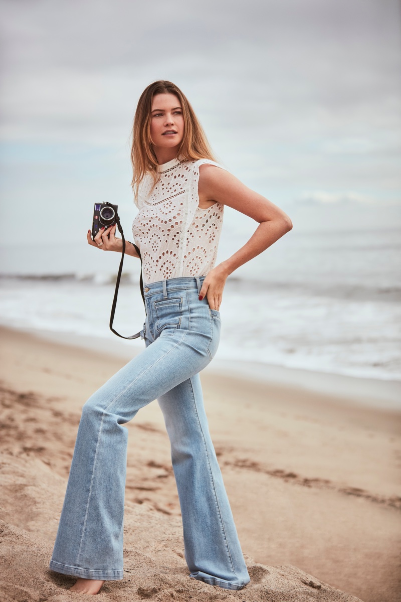 Behati Prinsloo poses on the beach in 7 For All Mankind spring-summer 2019 campaign