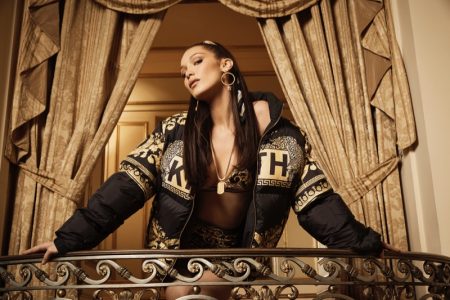 Bella Hadid poses in graphic jacket from Kith x Versace collaboration