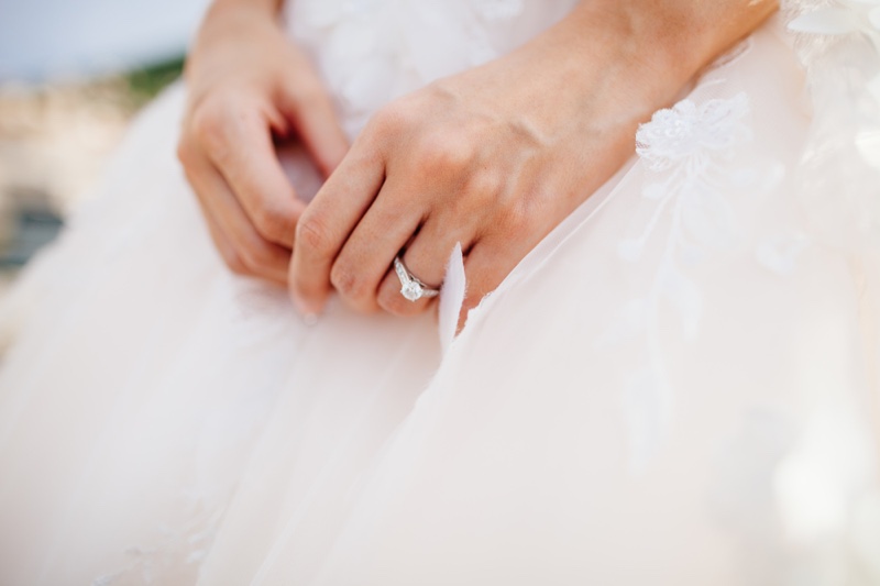 Bride Wearing Engagement Ring in Wedding Dress