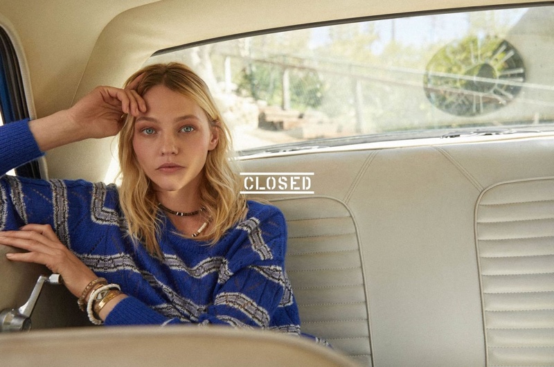 Sasha Pivovarova poses in the back of a car for Closed spring-summer 2019 advertising campaign