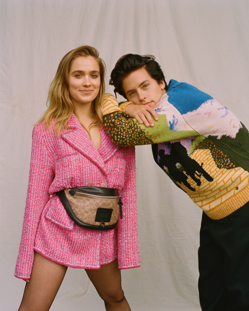 Haley Lu Richardson poses in pink jacket look while modeling alongside Cole Sprouse