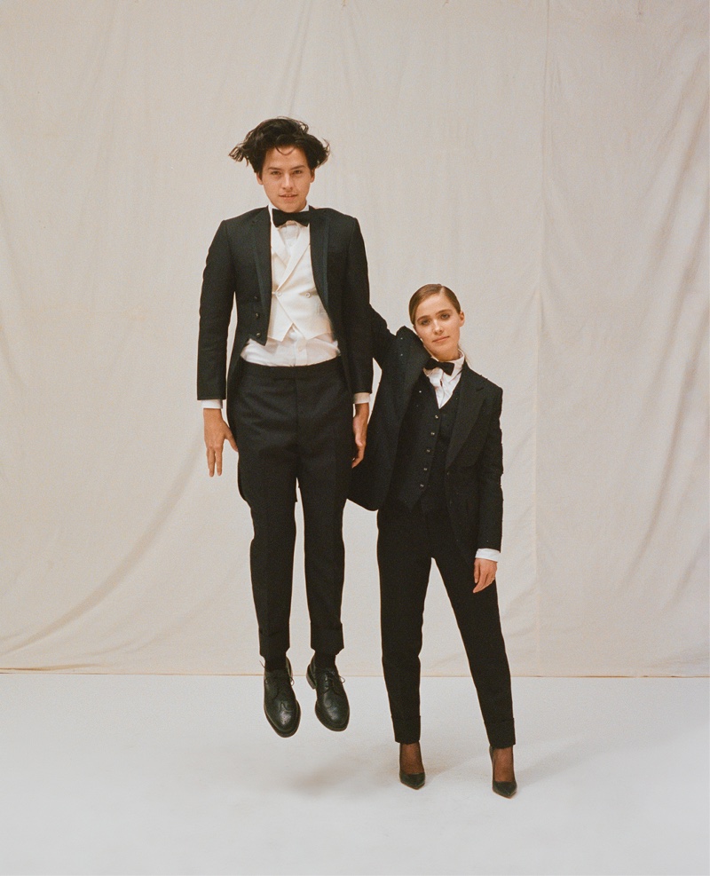 Actors Cole Sprouse and Haley Lu Richardson suit up in black