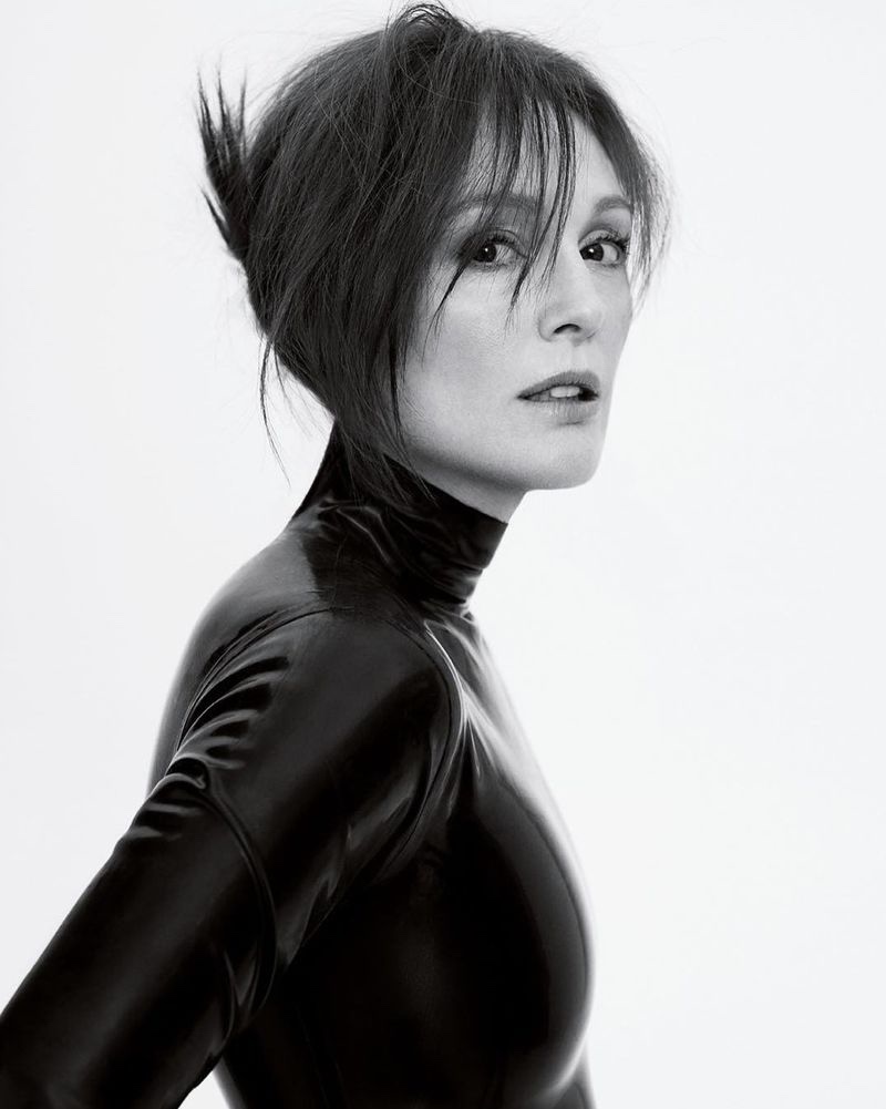 Wearing her hair in an updo, Julianne Moore poses in black and white